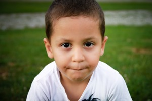 Young hispanic boy with wistful expression